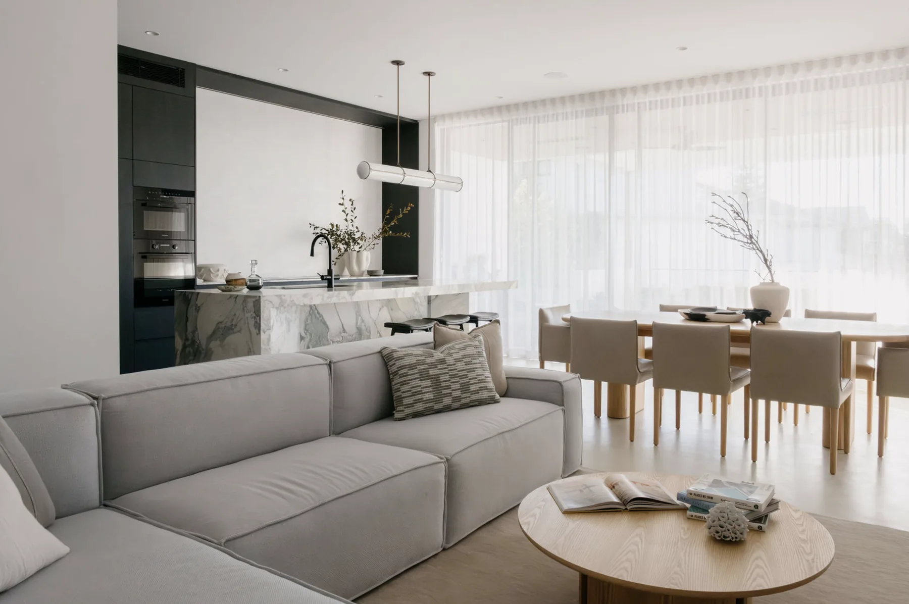 Freshwater &mdash; living room with grey sofa looking through to the kitchen and dining table