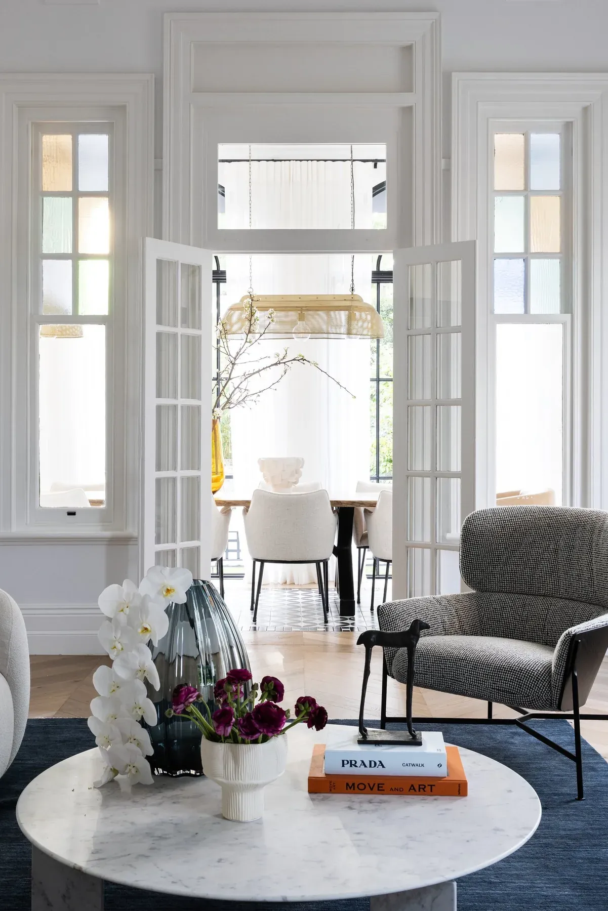Mosman 01 &mdash; sitting room with grey armchair, marble coffee table and French doors