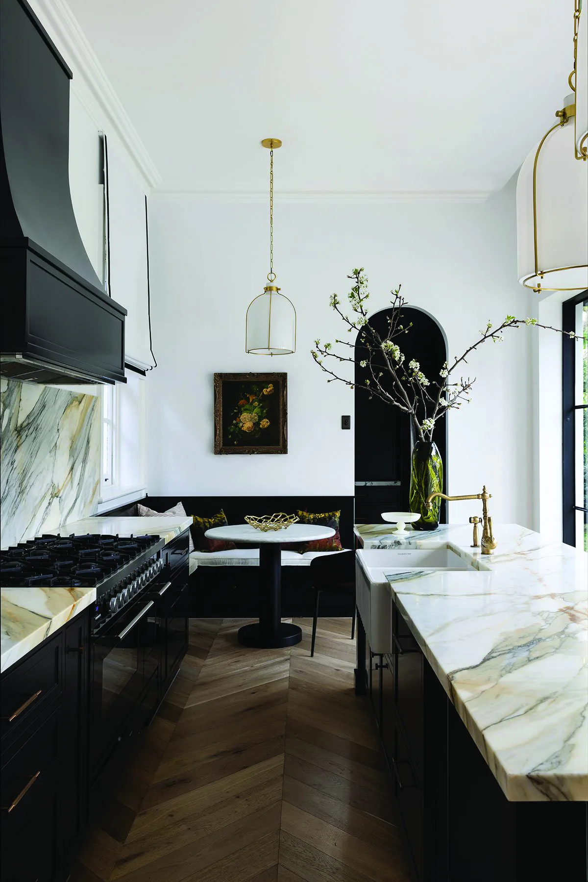 Mosman 01 &mdash; kitchen with black rangehood, marble splashback and herringbone timber floor