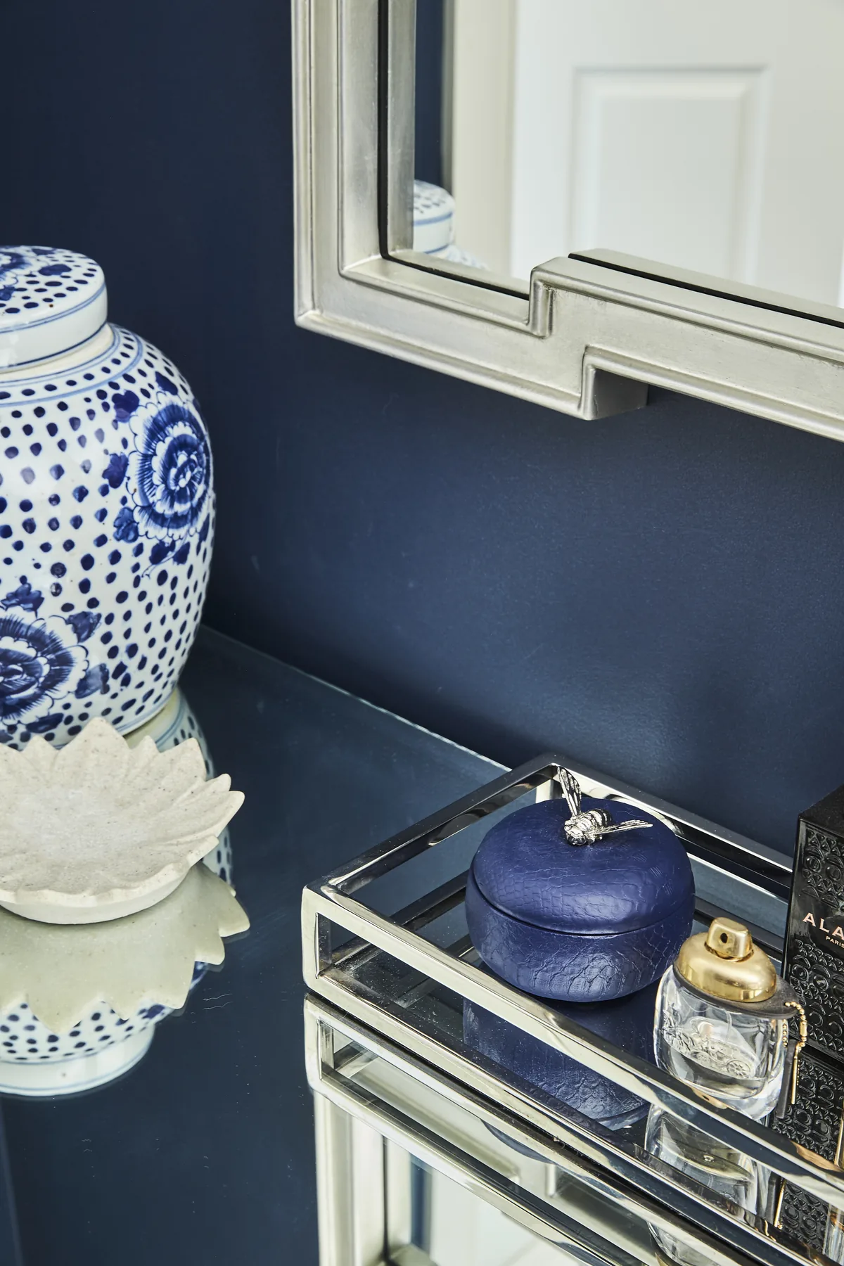Wahroonga &mdash; navy wall with a blue-and-white ginger jar and mirrored tray