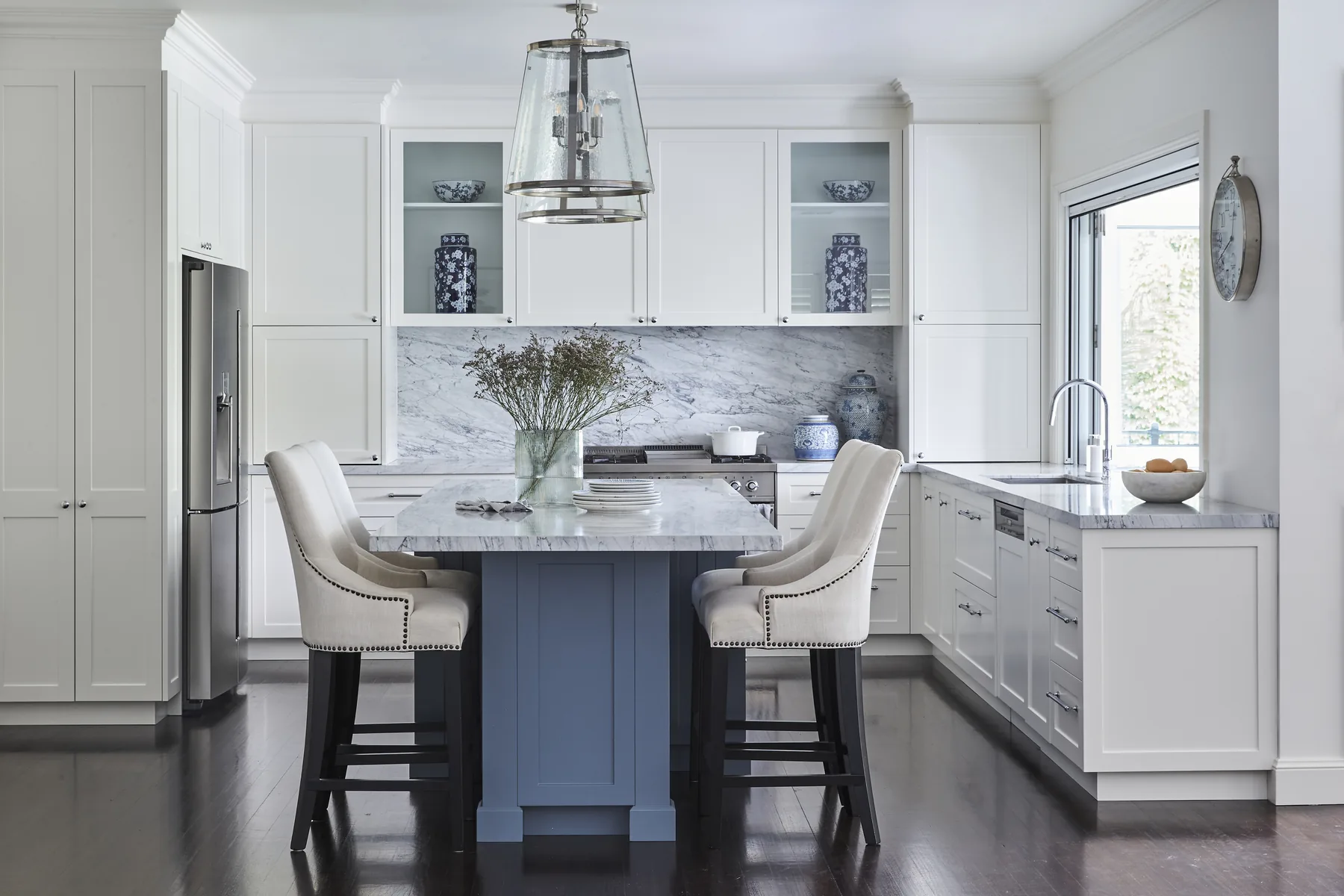 Wahroonga &mdash; white kitchen with blue island, marble benchtop and glass pendant